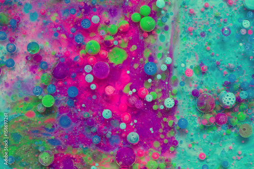 Colourful and beautiful effect of water paint and oil mixing. Multicoloured abstract bubbles.