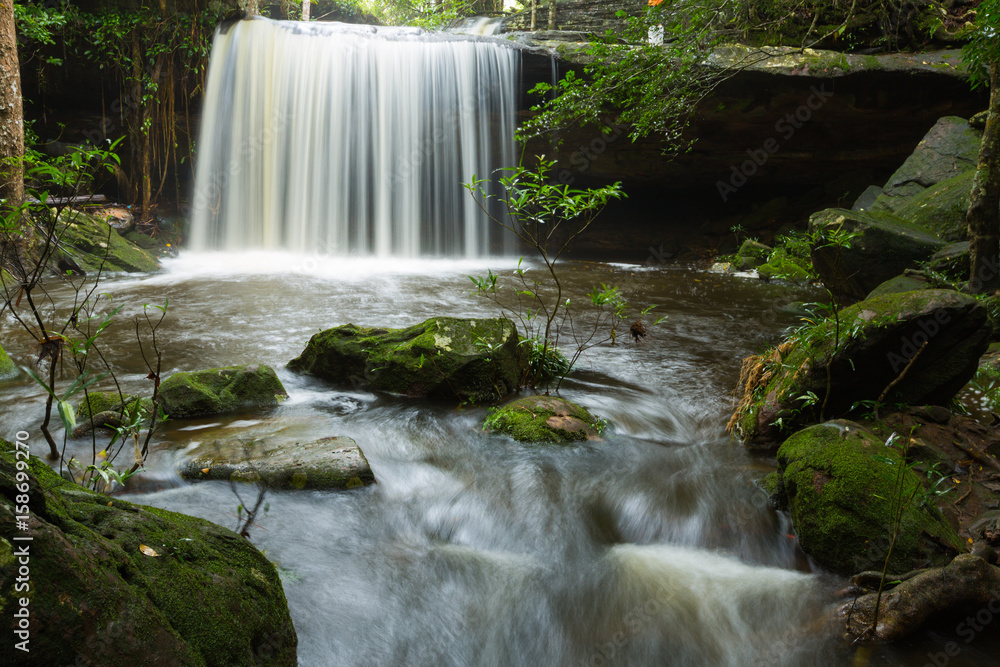 Fototapeta premium Waterfall in thai national park. In the deep forest on mountain. 
