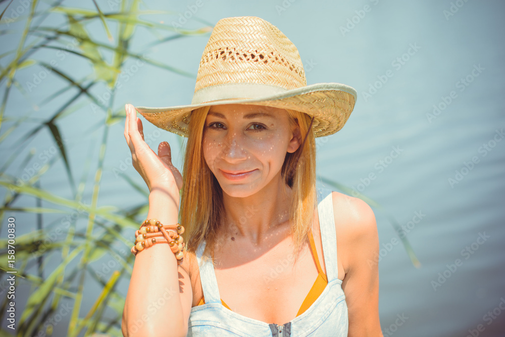Portrait cute and simple American young woman on a nature near good view