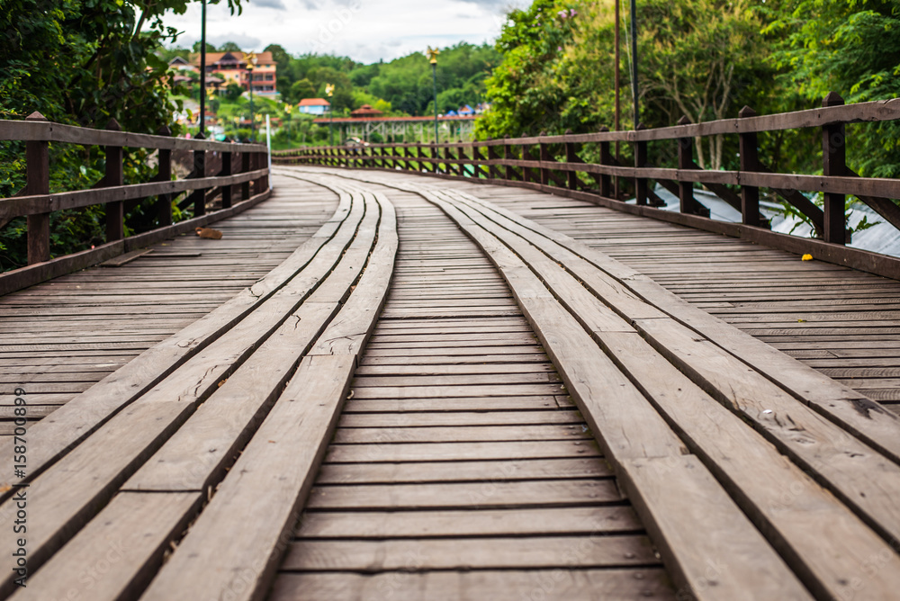 (Mon Bridge) Wooden bridge over the river in Sangkhlaburi District, Kanchanaburi, Thailand. (Mon Bridge) Wooden bridge over the river in Sangkhlaburi District, Kanchanaburi, Thailand.