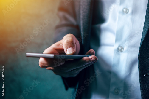 Hand with mobile phone texting