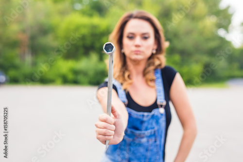 Wallpaper Mural beautiful young woman repairing the car Torontodigital.ca