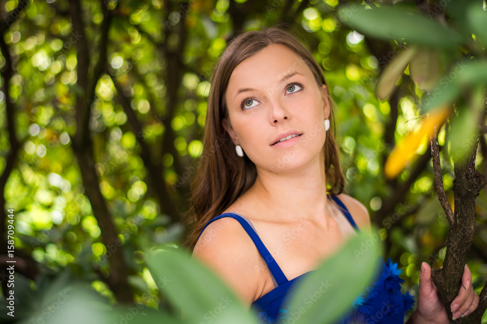 Beautiful woman enjoys nature in summer bloom. Perfect body. The girl has a beautiful face, bright eyes. Photo was taken in nature in summer solstice. Beautiful woman enjoys nature in summer bloom. Perfect body. The girl has a beautiful face, bright eyes. Photo was taken in nature in summer solstice.