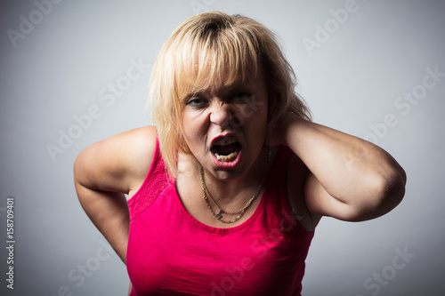 Angry woman baring her teeth.