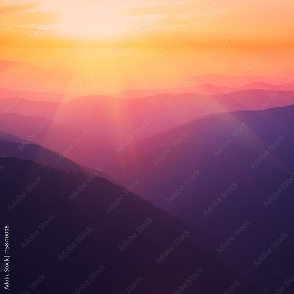 Fototapeta premium Silhouettes of the mountain hills at sunset