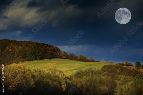 autumnal landscape with moon