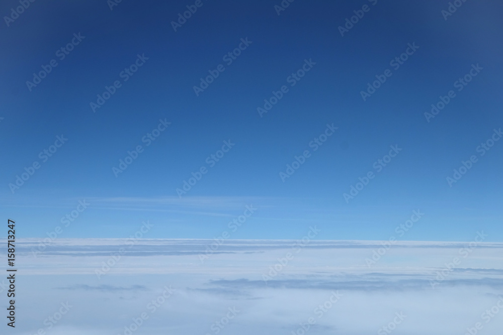 Stratus cloud over stratosphere on the blue sky taken on the airplane Stratus cloud over stratosphere on the blue sky taken on the airplane