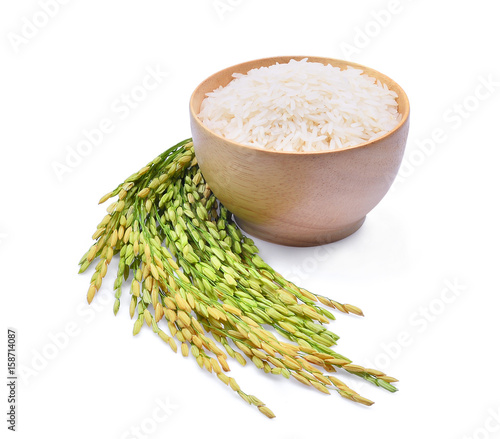 Fotografie, Obraz white rice (Thai Jasmine rice) in wooden bowl and green paddy rice isolated on w