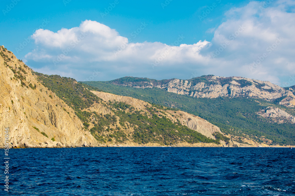 The seascape. The sea and the mountains on the coastline The seascape. The sea and the mountains on the coastline