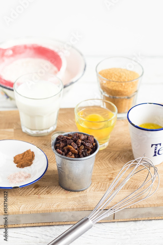 Baking ingredients for pastry on white wooden rustic table. Step by step recipe. 