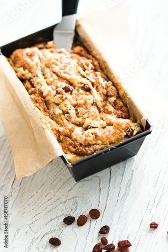 Raw cinnamon loaf cake dough in a pan. Step by step baking preparation process. White food photography