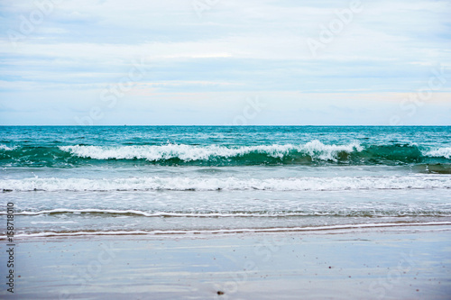 sand beach with blue ocean