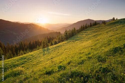 Sunset in the mountain valley. Beautiful natural landscape in the summer time