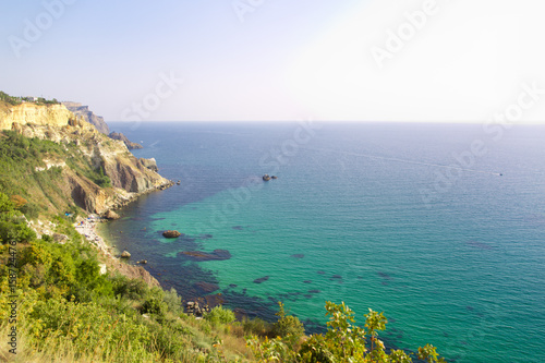 Rocky beach at the foot of the mountain