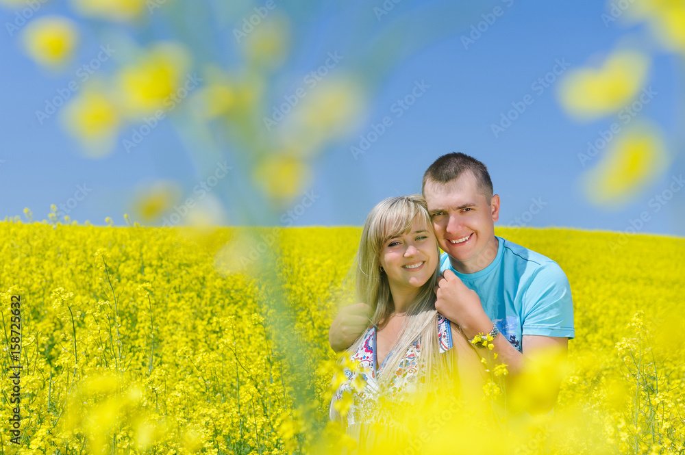 Happy couple in yellow rape field. Happy couple in yellow rape field.