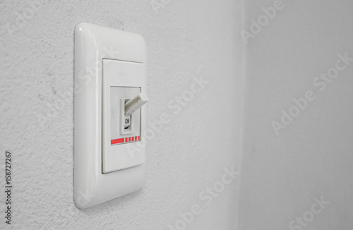 wall light switch in the on position photo