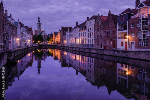 Jan van Eyckplein, old town of Bruges, Belgium during sunset.