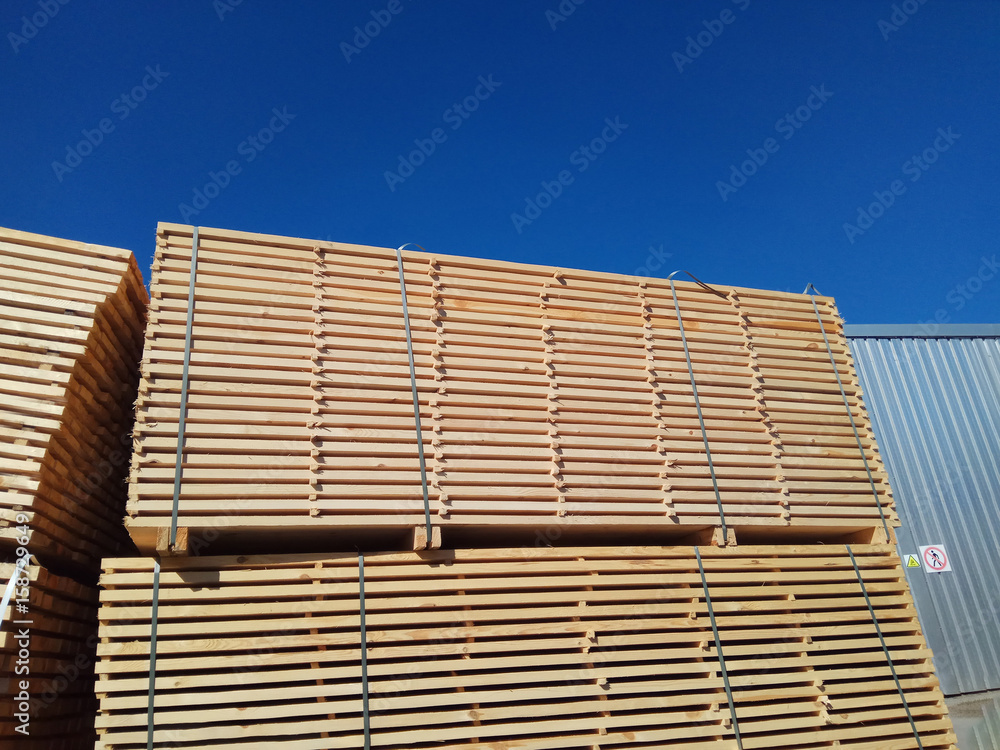 stack of wooden planks at the lumber yard stack of wooden planks at the lumber yard