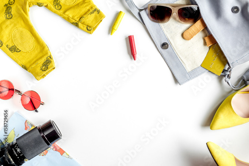 tourist outfit and camera for trip with kids white background top view mockup