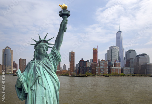 Skyline of Manhattan with Liberty Statue on front © gdvcom