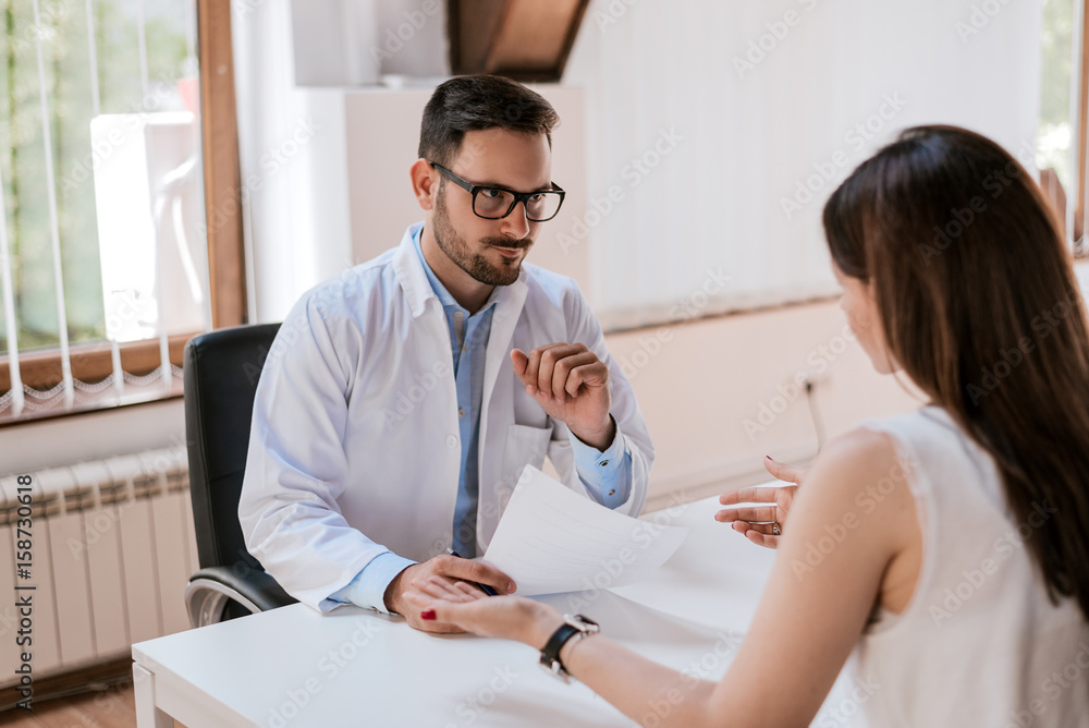 Patient is telling doctor about his health problems. Patient is telling doctor about his health problems.
