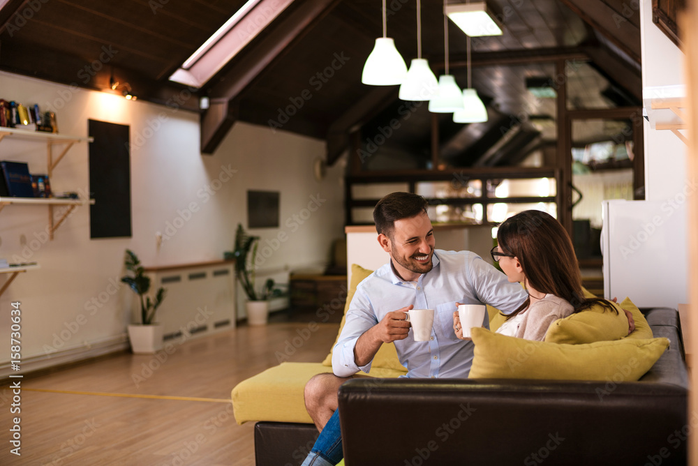 Young couple spending time in the living room Young couple spending time in the living room