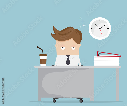 businessman falling asleep at desk in office