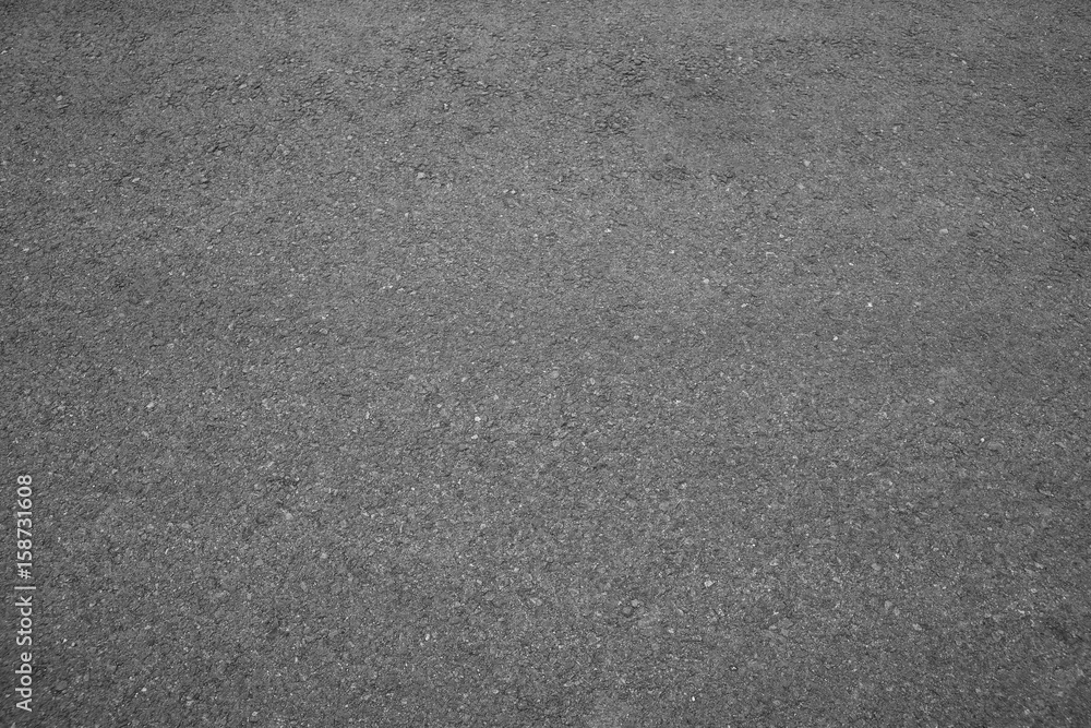 Fototapeta premium Asphalt background texture with some fine grain with road