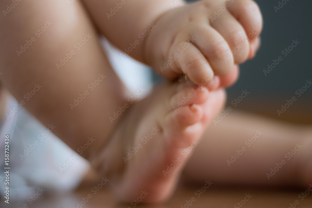 small baby bare foot and hand closeup small baby bare foot and hand closeup