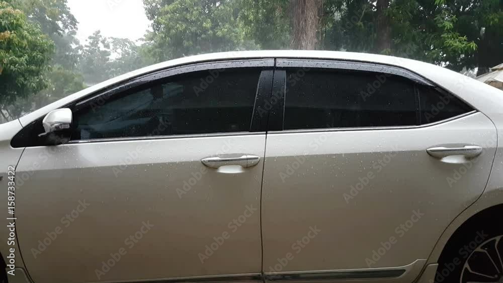 close-up car parking in the rain, Thailand close-up car parking in the rain, Thailand