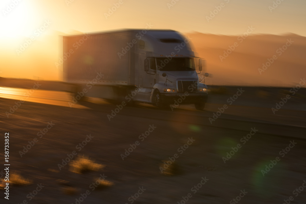 American style truck on freeway pulling load. Transportation theme