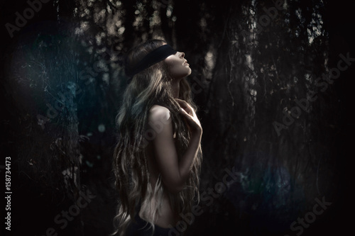 Canvastavla Young beautiful blindfolded woman in forest