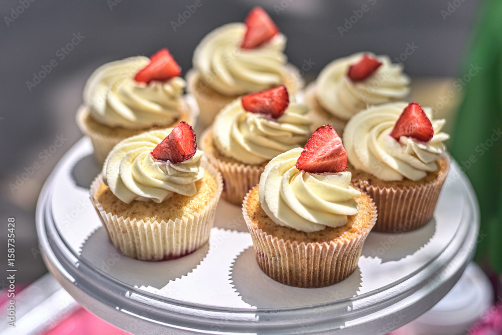 Strawberry Cupcakes on a white table. Summer delicious colorful desserts