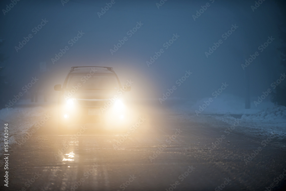 Headlights of car driving in fog - obrazy, fototapety, plakaty 