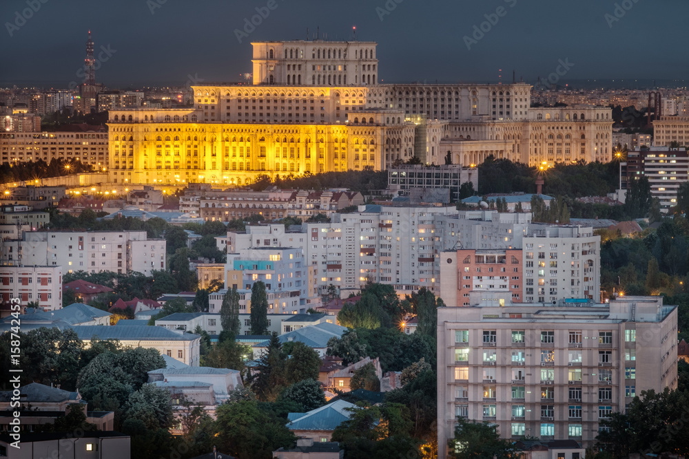 Aerial view of the Parliament building in Bucharest, Romania at nigh time.