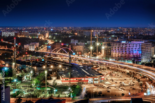 Aerial wide angle view of Bucharest Basarab  Romania. Traffic and buildings at night.