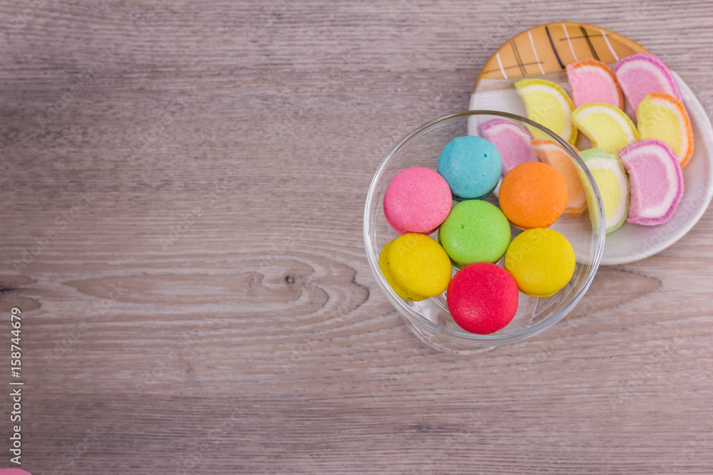 Sweet colorful macaroons on a wood background Sweet colorful macaroons on a wood background