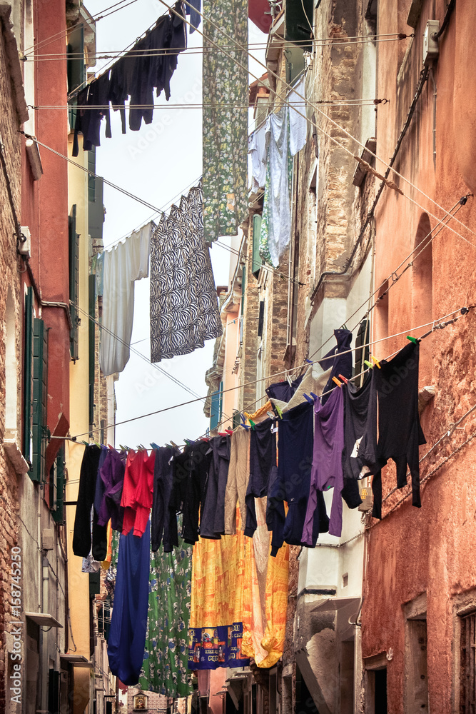 Venice hangs out the clothes. the objects are drying in the sun