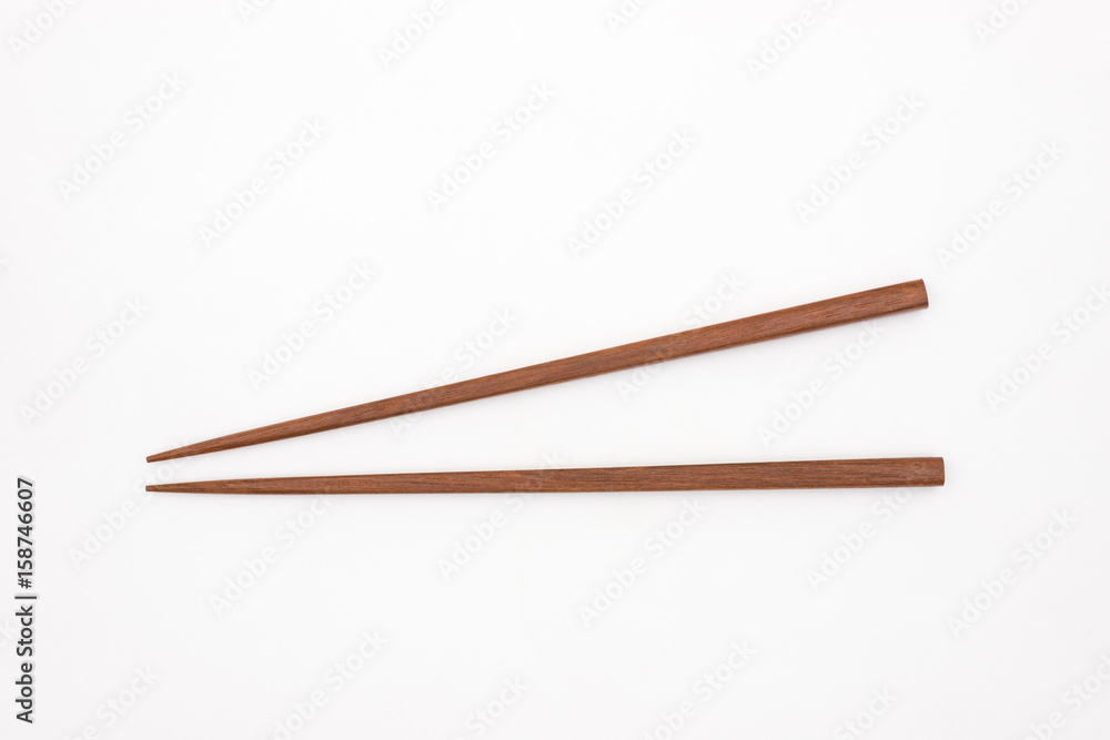 Traditional Japanese wooden chopsticks on white background Traditional Japanese wooden chopsticks on white background