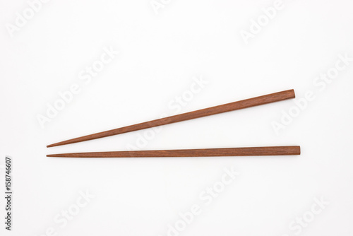 Traditional Japanese wooden chopsticks on white background