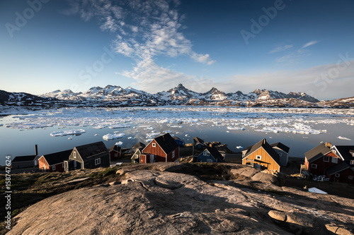 Greenland village near iceberg fjord