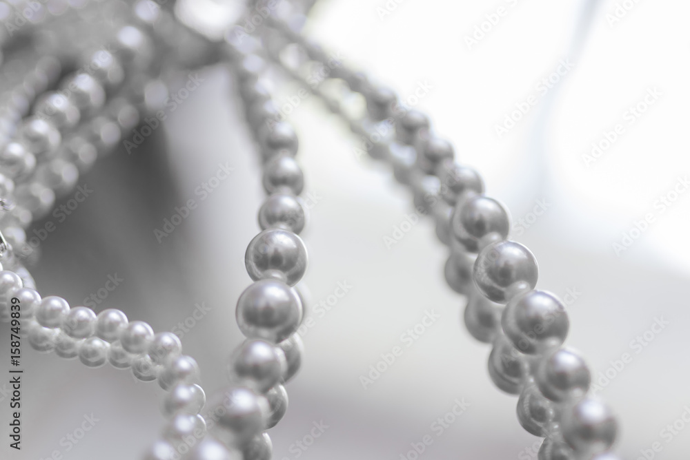 Pearl necklace on a mirror surface Pearl necklace on a mirror surface