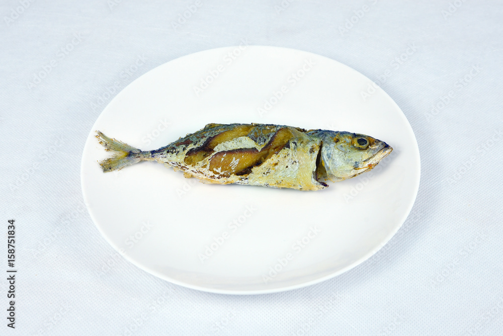 .Fried Short-bodied mackerel in white background, Thai food.