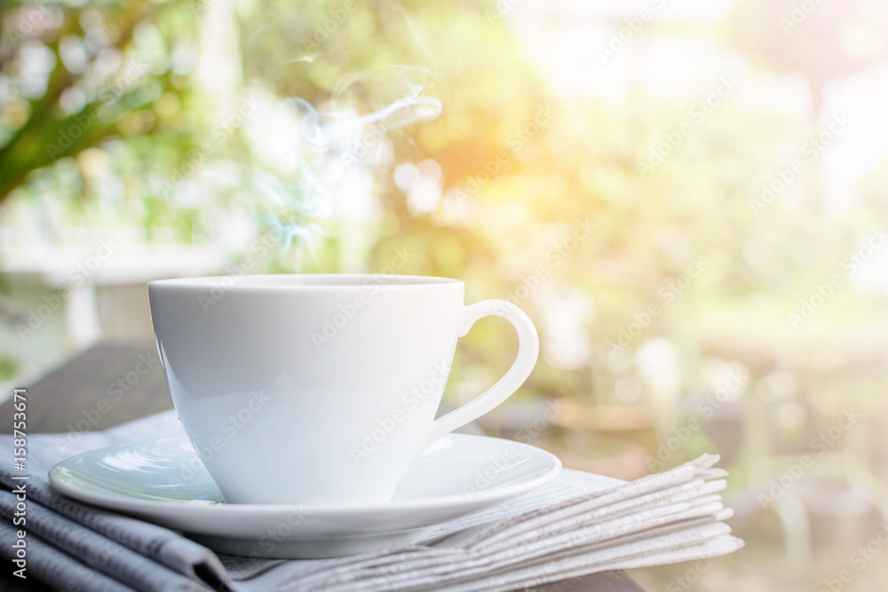 coffee cup clock and news paper on old wooden table nature background coffee cup clock and news paper on old wooden table nature background