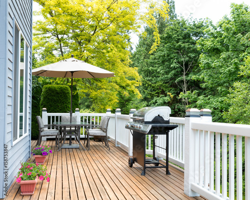 Tela Home deck and patio with outdoor furniture and BBQ cooker