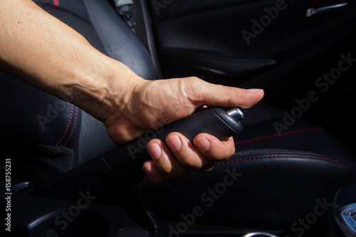 Pulling handbrake.Car Interior © torsak