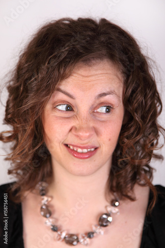 Fotografija attractive young woman wrinkles her nose and sneers in judgment