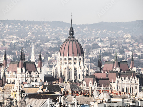 Huge dome of Hungarian Parliament Building - Orszaghaz. Unusual view from St. Stephen's Basilica. Budapes, Hungary.