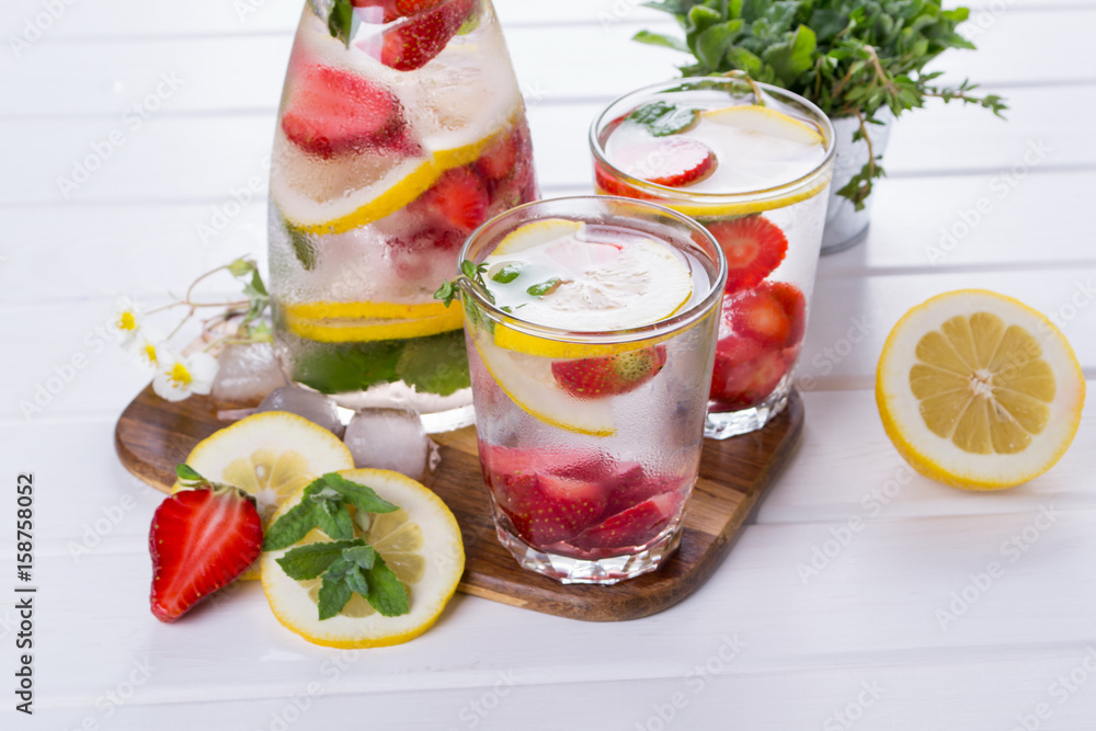 Fruit and herb infused water. Cold refreshing vitamin detox water. Summer drink Fruit and herb infused water. Cold refreshing vitamin detox water. Summer drink