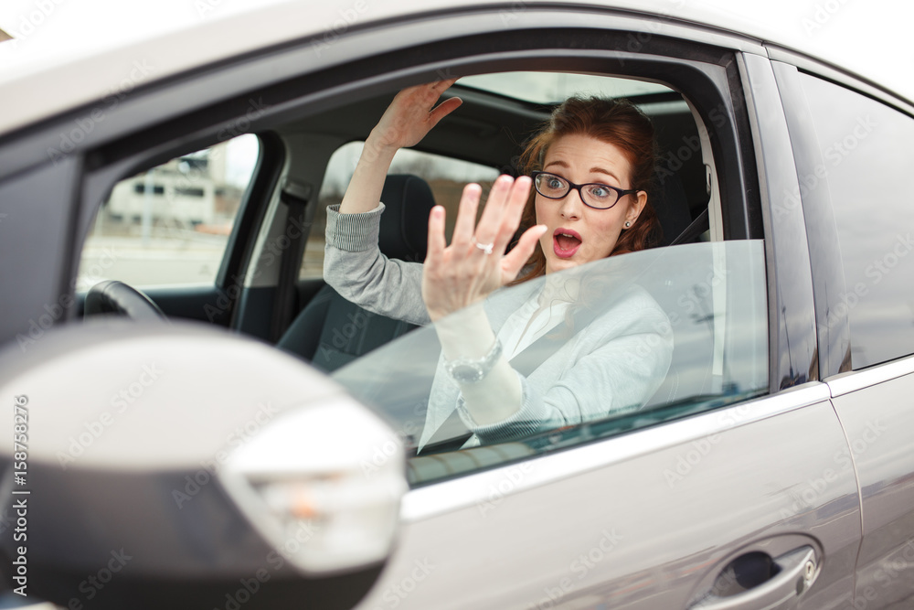  Amid a bustling city, the determined businesswoman finds herself ensnared in a frustrating traffic jam on her way to a vital meeting.	